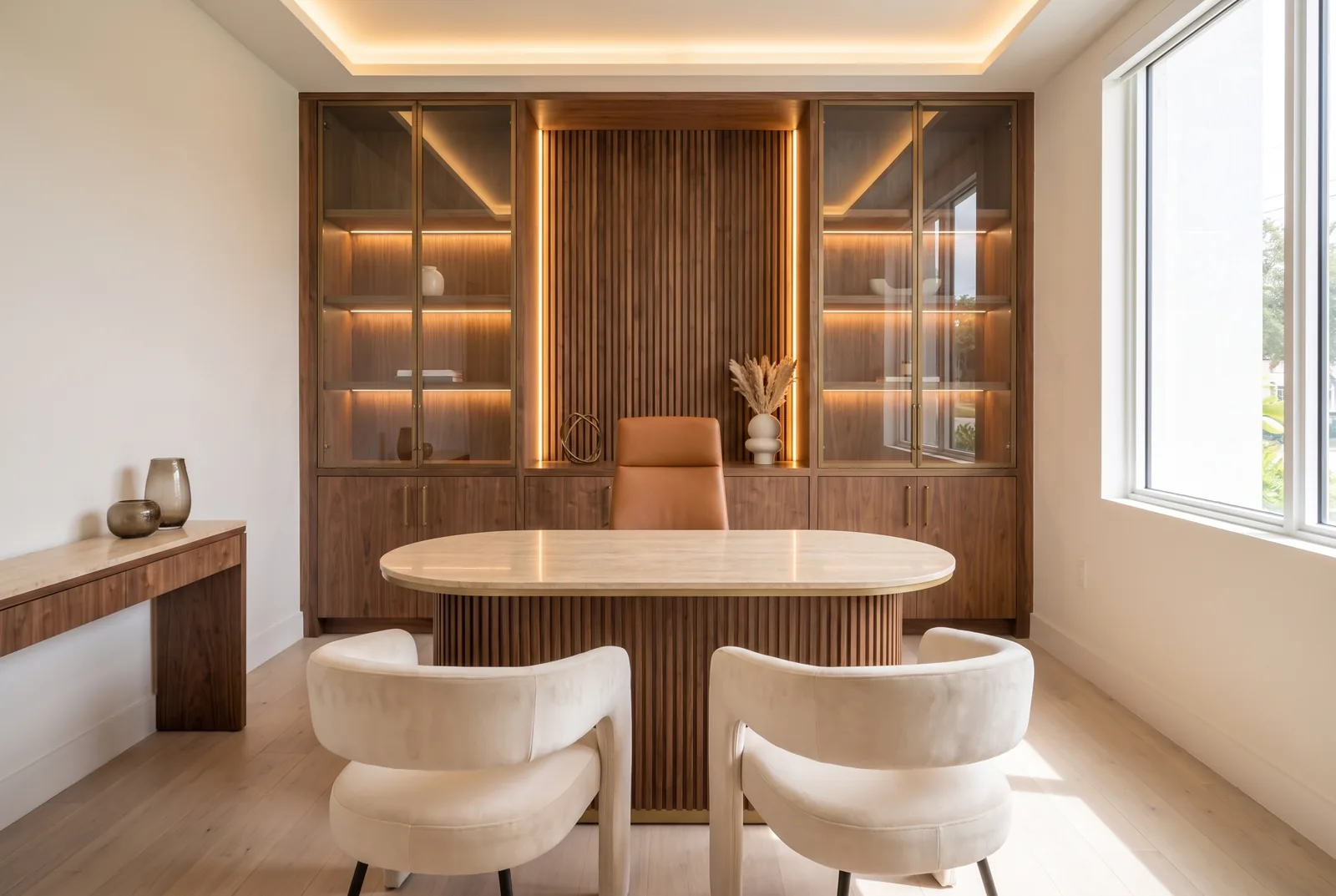 Concept rendering, owner's office, Bespoke level: walnut and bronze wall unit, stone-top desk, cove lighting