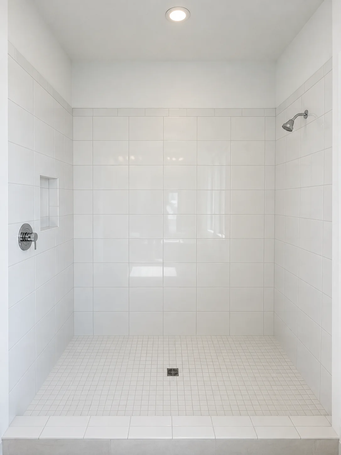 Walk-in shower with plain white tile — before