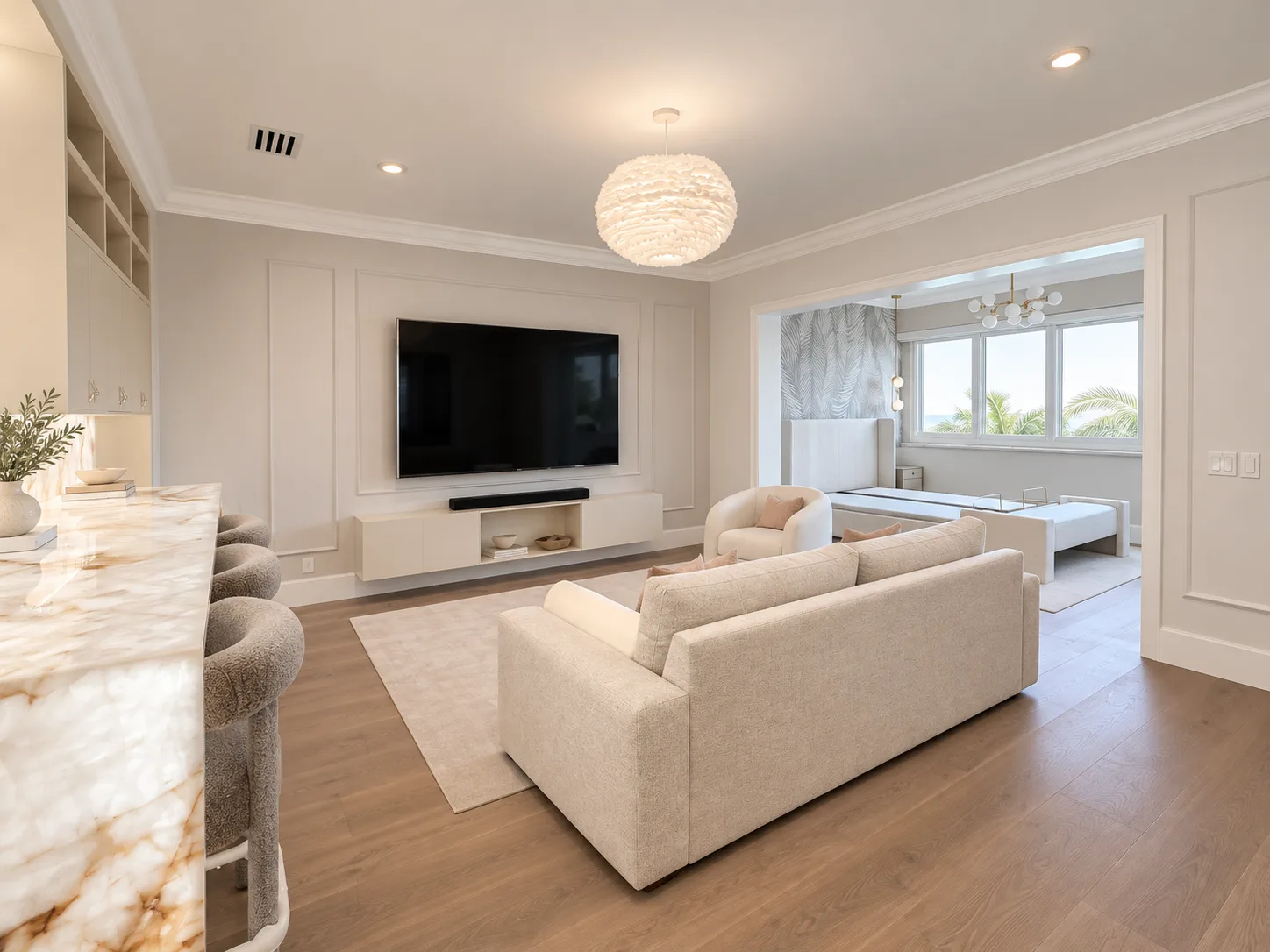 Family room with a panelled media wall, low TV console and built-in shelving at the side